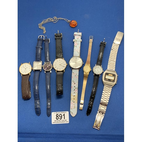 891 - Silver mounted amber pendant and eight watches