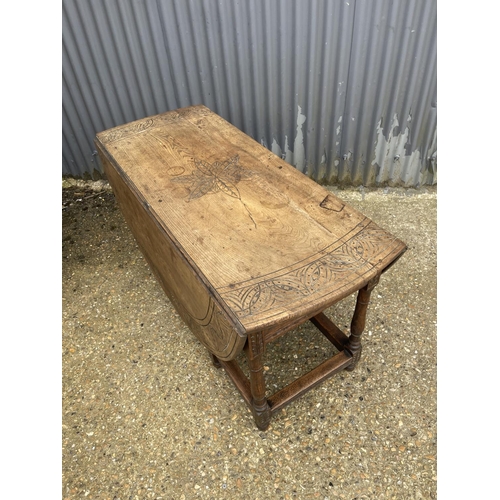 110A - A large antique oak gateleg table with drawer 135x56