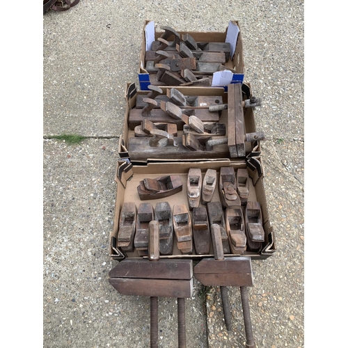 510A - Three trays of wooden planes and three clamps