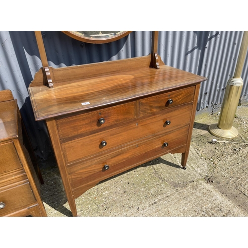 107 - A mahogany four drawer dressing chest together with a oak dressing chest