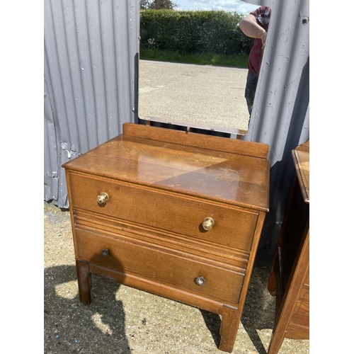 107 - A mahogany four drawer dressing chest together with a oak dressing chest