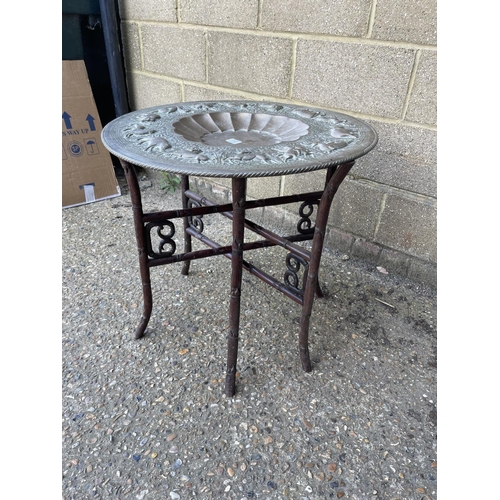 113 - An Brass tray top table raised on oriental hardwood folding base