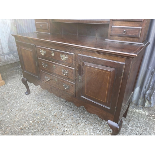 115 - An inlaid mahogany dresser