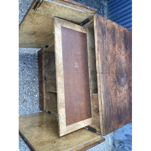 121 - A deco style walnut workstation cabinet with burr walnut fitted interior, brown leather top writing ... 