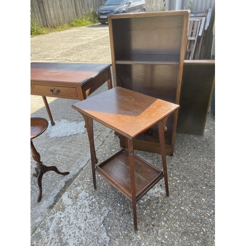 124 - A mahogany two drawer writing table, occaional table, wine table, bookcase and card table