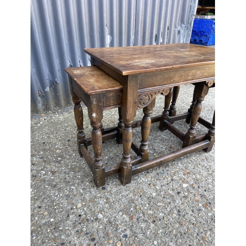 125a - An oak nest of three tables