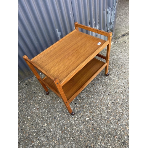 129 - A danish teak tea trolley, labelled MADE IN DENMARK