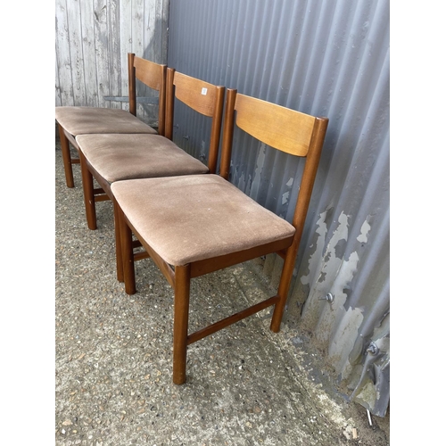 130 - Three teak dining chairs