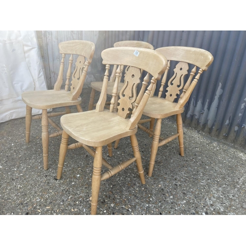 133 - A set of four pine dining chairs