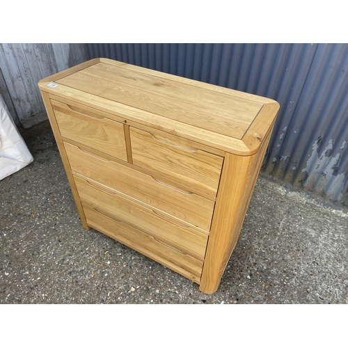 138 - A light oak chest of five drawers from OAK FURNITURE LAND 98x44x100