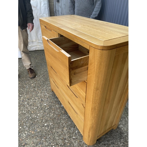 139 - A light oak chest of five drawers from OAK FURNITURE LAND 98x44x100