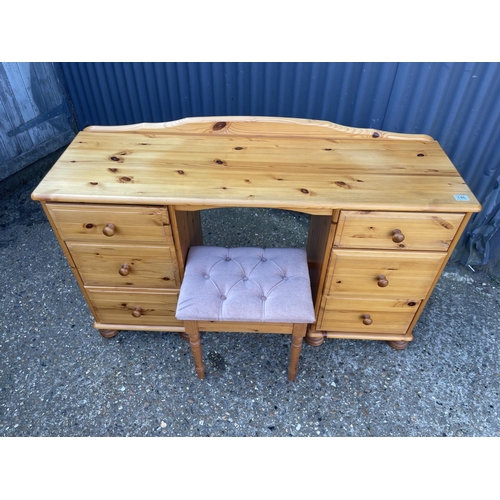 146 - A six drawer pine desk with stool