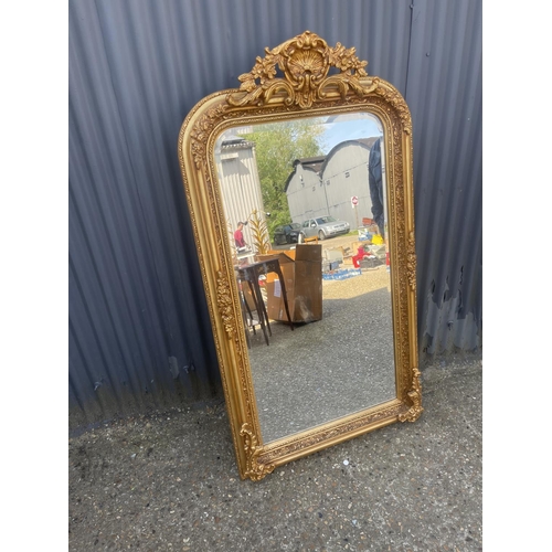 152 - A large ornate gold gilt wall mirror 80x160 cms