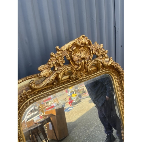 152 - A large ornate gold gilt wall mirror 80x160 cms