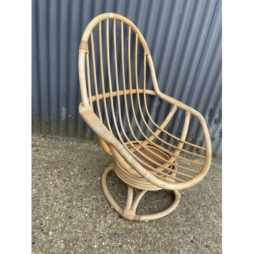 17 - A retro bamboo swivel and spring chair