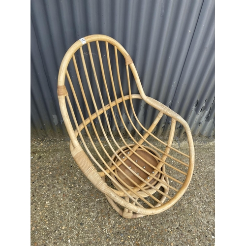 17 - A retro bamboo swivel and spring chair