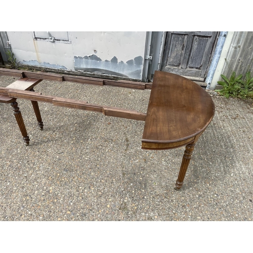 25 - A victorian walnut 6 leg pull out dining table with two extension leaves (capacity for 4 or 5) curre... 