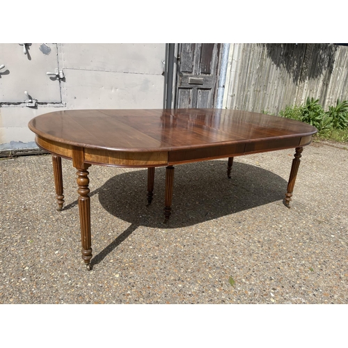 25 - A victorian walnut 6 leg pull out dining table with two extension leaves (capacity for 4 or 5) curre... 