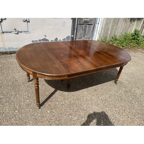 25 - A victorian walnut 6 leg pull out dining table with two extension leaves (capacity for 4 or 5) curre... 