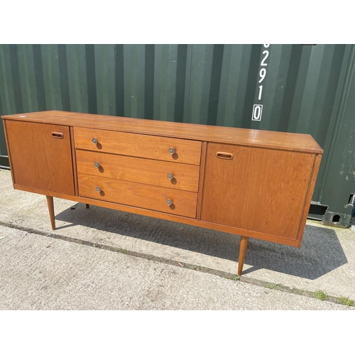 306 - A mid century teak sideboard