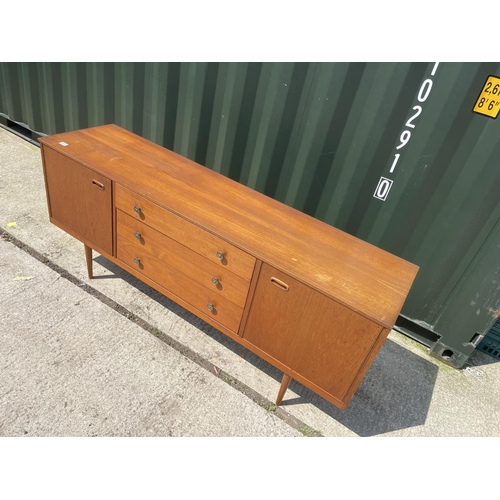 306 - A mid century teak sideboard