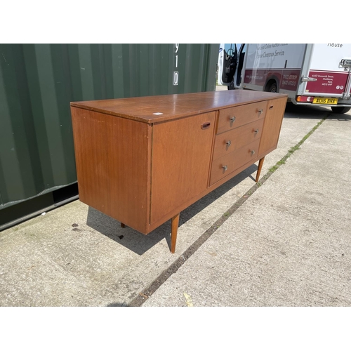 306 - A mid century teak sideboard