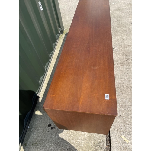 306 - A mid century teak sideboard