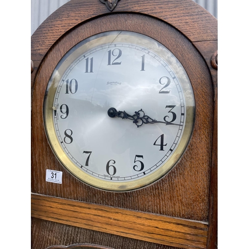 31 - A deco style oak cased longcase clock by BRAVINGTONS with pendulum and three weights