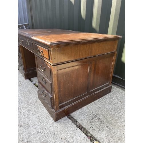 314 - An Edwardian mahogany twin pedestal desk with brown leather top