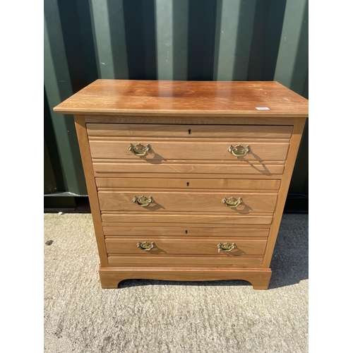 315 - A satinwood chest of three drawers