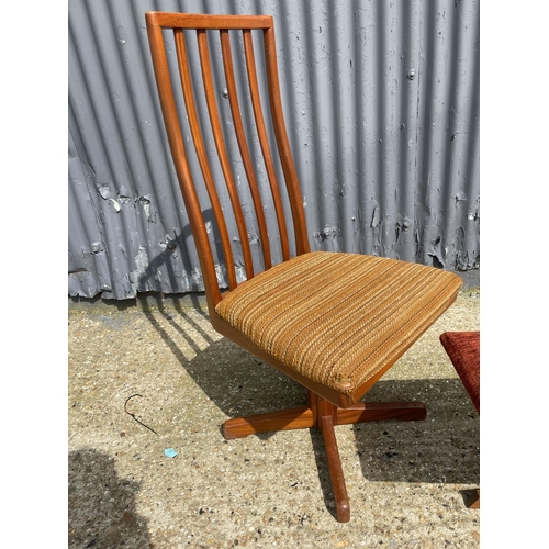 32 - A Danish style teak chair together with similar teak stool