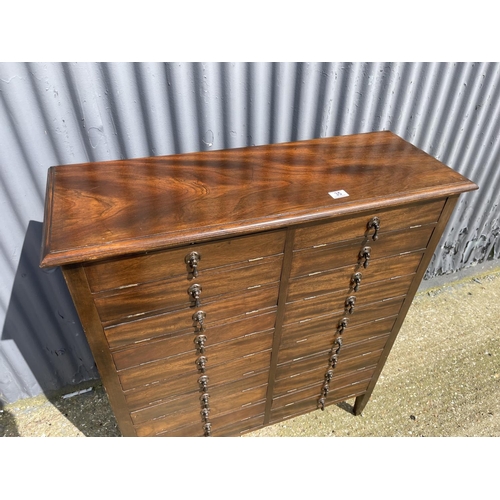 35 - A early 20th century oak specimen / music cabinet with drop fronts 93x35x110