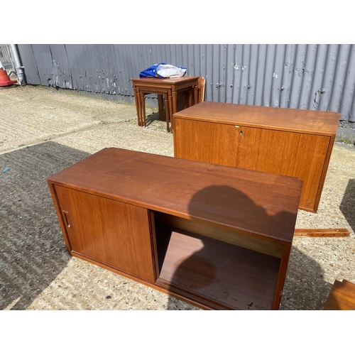 36 - A large danish teak wall furniture system, including two chests, two workstations, bureau, 3 cabinet... 