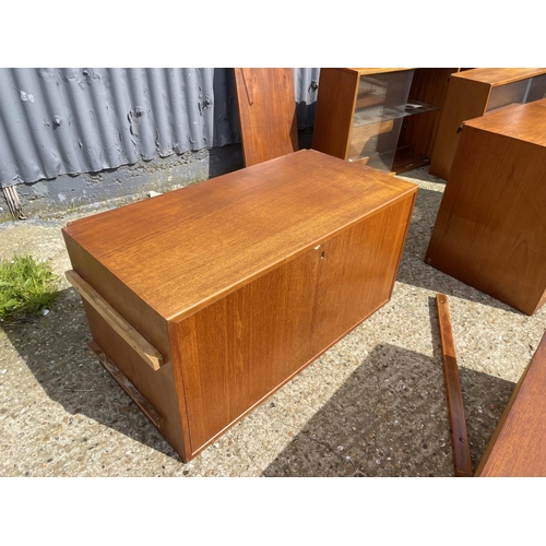 36 - A large danish teak wall furniture system, including two chests, two workstations, bureau, 3 cabinet... 