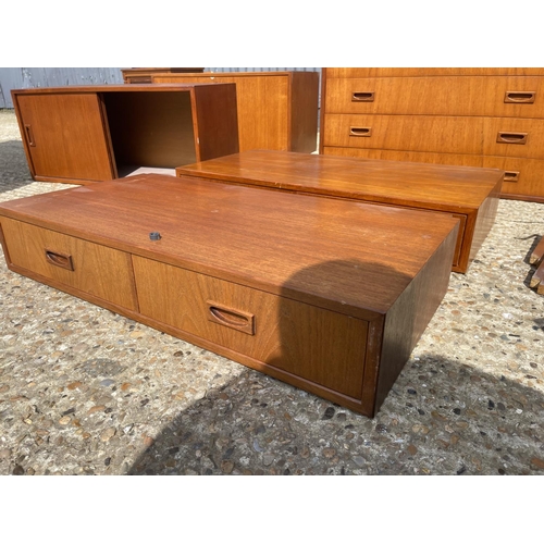 36 - A large danish teak wall furniture system, including two chests, two workstations, bureau, 3 cabinet... 