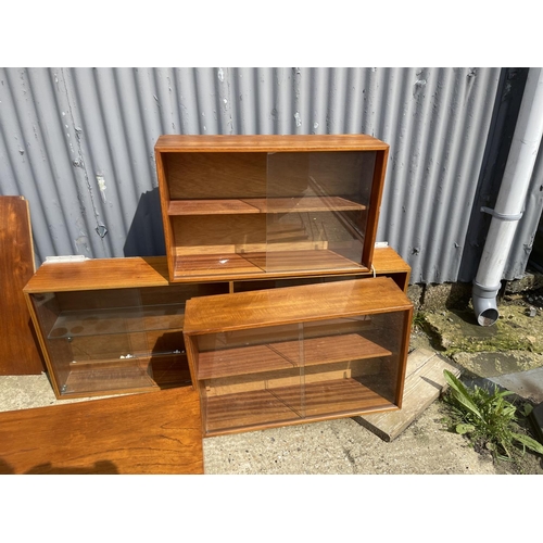 36 - A large danish teak wall furniture system, including two chests, two workstations, bureau, 3 cabinet... 