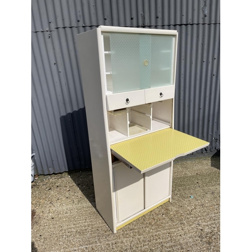 40 - A vintage yellow and white painted kitchen cabinet with drop down front