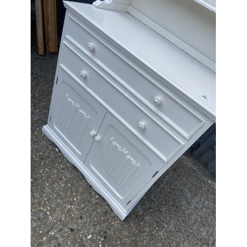 48 - An oak linen fold dresser painted white