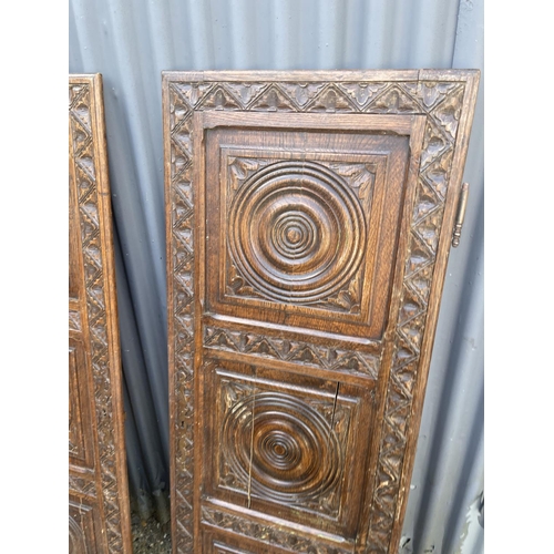 50 - A pair of carved oak doors / panels 148cm high