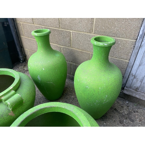 52 - A collection of five large green plastic urns / planters