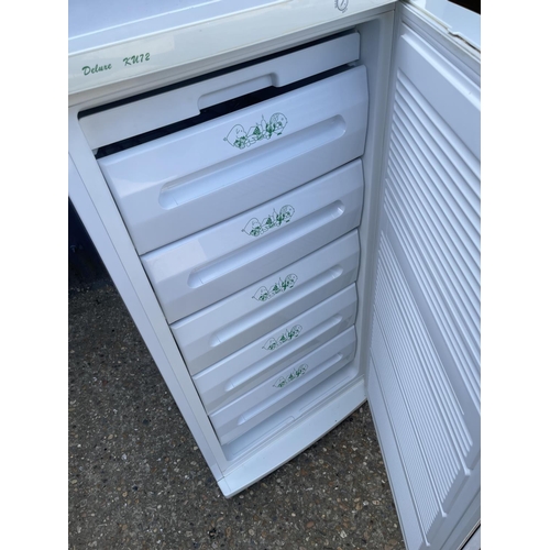 57 - An upright larder freezer