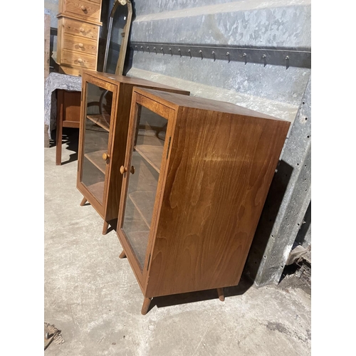 6 - A pair of teak glazed cabinets with splayed teak legs