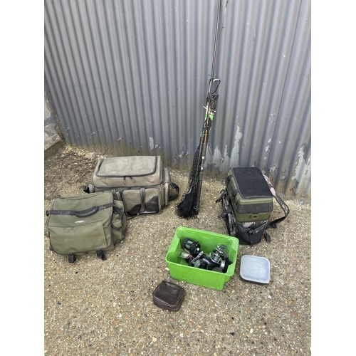 66 - Three modern fishing bags, rods and box containing reels etc