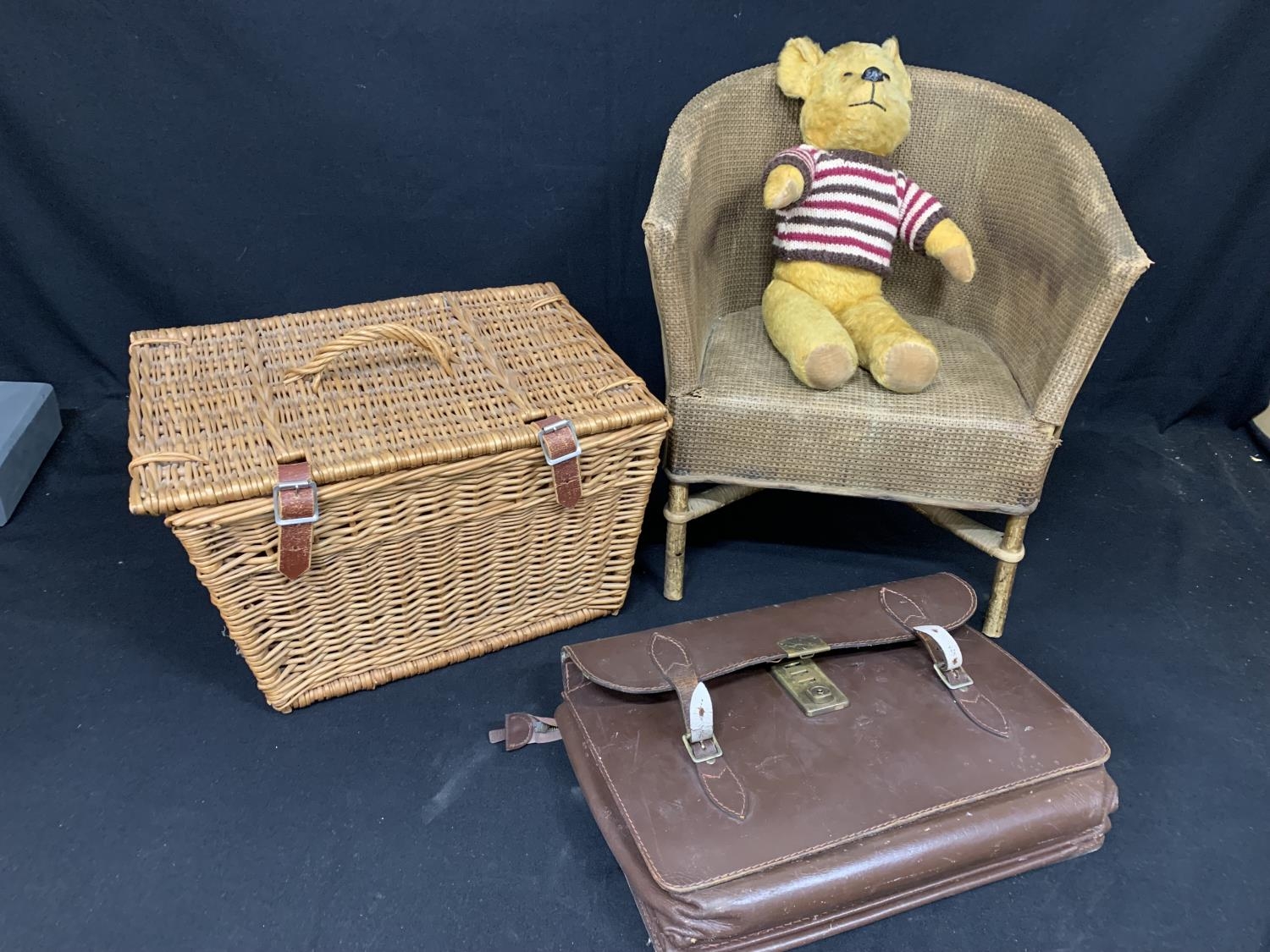 Vintage chair, teddy bear, wicker basket and briefcase