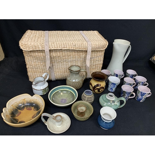 668 - Wicker basket with large qty studio pottery, incl. Weymouth, Wimborne, Sark, Canterbury, Poole, Buch... 