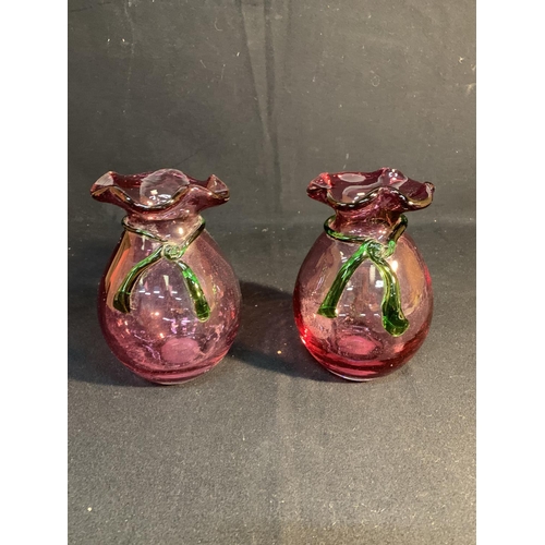 700 - Pair cranberry glass vases, height 18cms