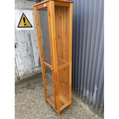 75 - A glazed pine tall shop cabinet (no shelves)