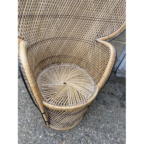 76 - A vintage wicker peacock chair