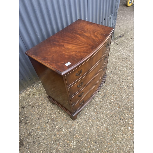 8 - A reproduction mahogany bow front chest of four drawers 77x50x85