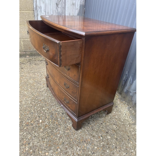 8 - A reproduction mahogany bow front chest of four drawers 77x50x85